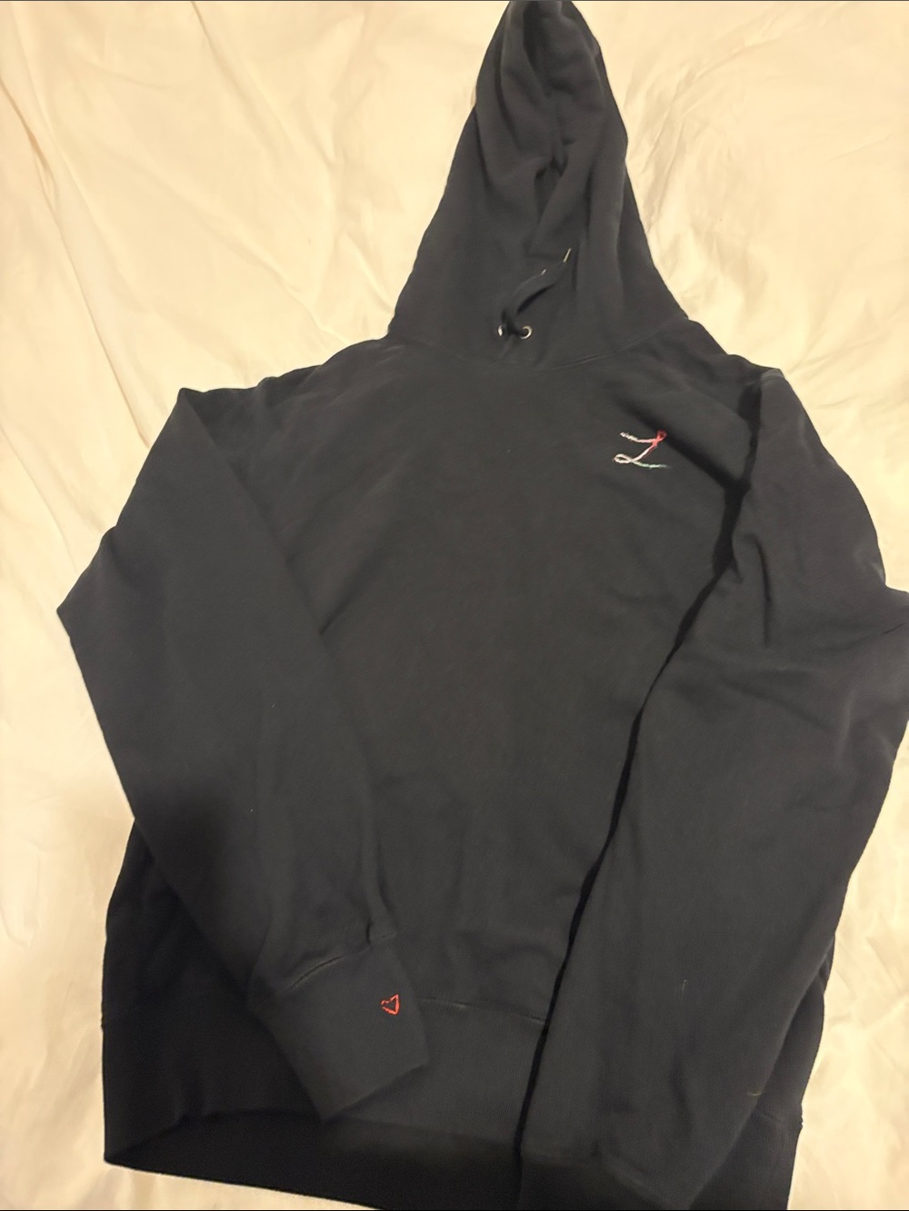 Uniqlo Black Hooded Sweatshirt with Small Red Accent